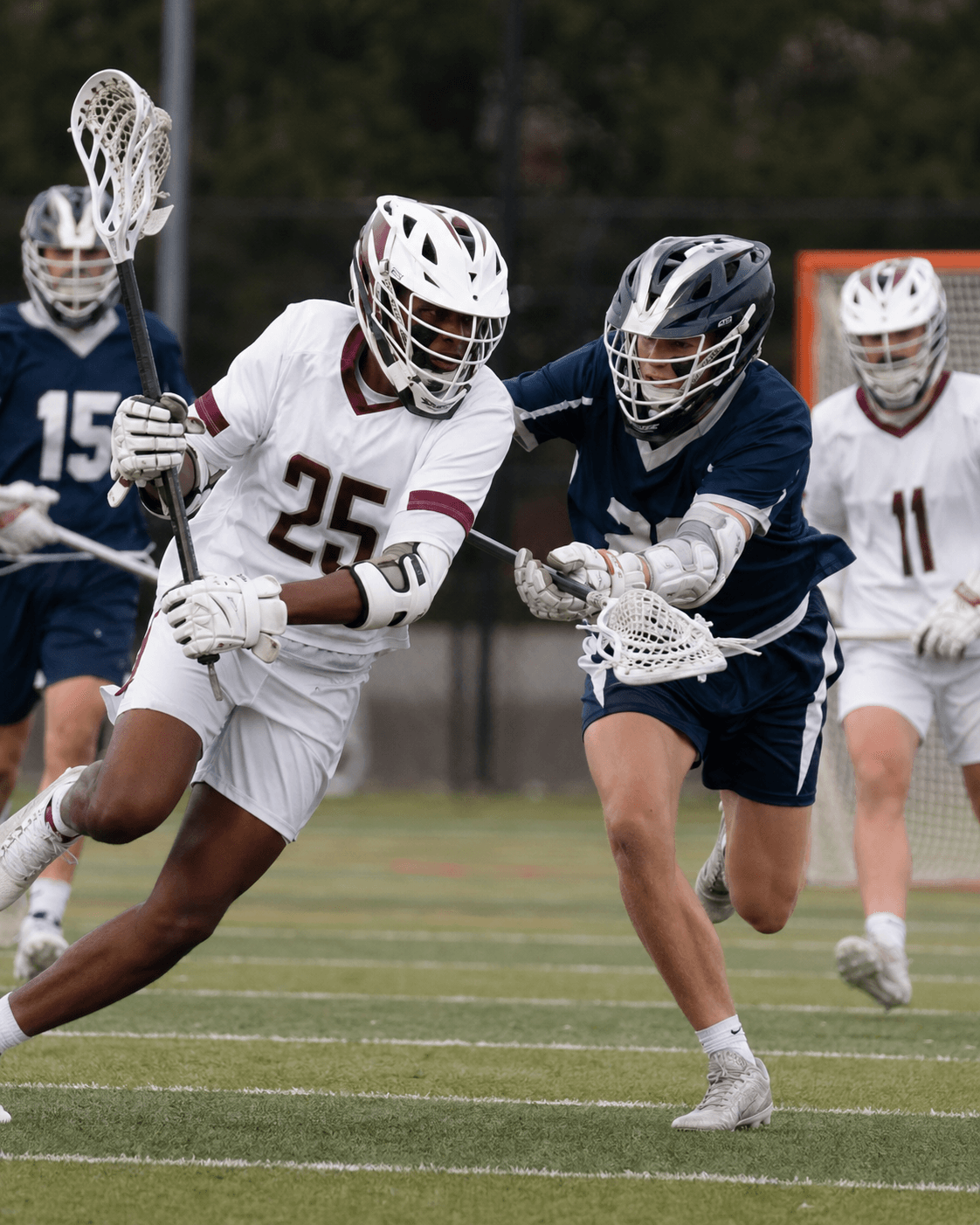 Boys high school lacrosse attackman in a maroon jersey dodging a defender on a Virginia game day.